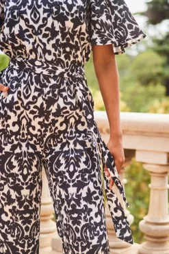 Black & White Mono Print Satin Angel Sleeve Wide Leg Jumpsuit 8 Black & White Mono Print Satin Angel Sleeve Wide Leg Jumpsuit -Trendora Shop web 2307 83 s23jw038bkcv01 83 230